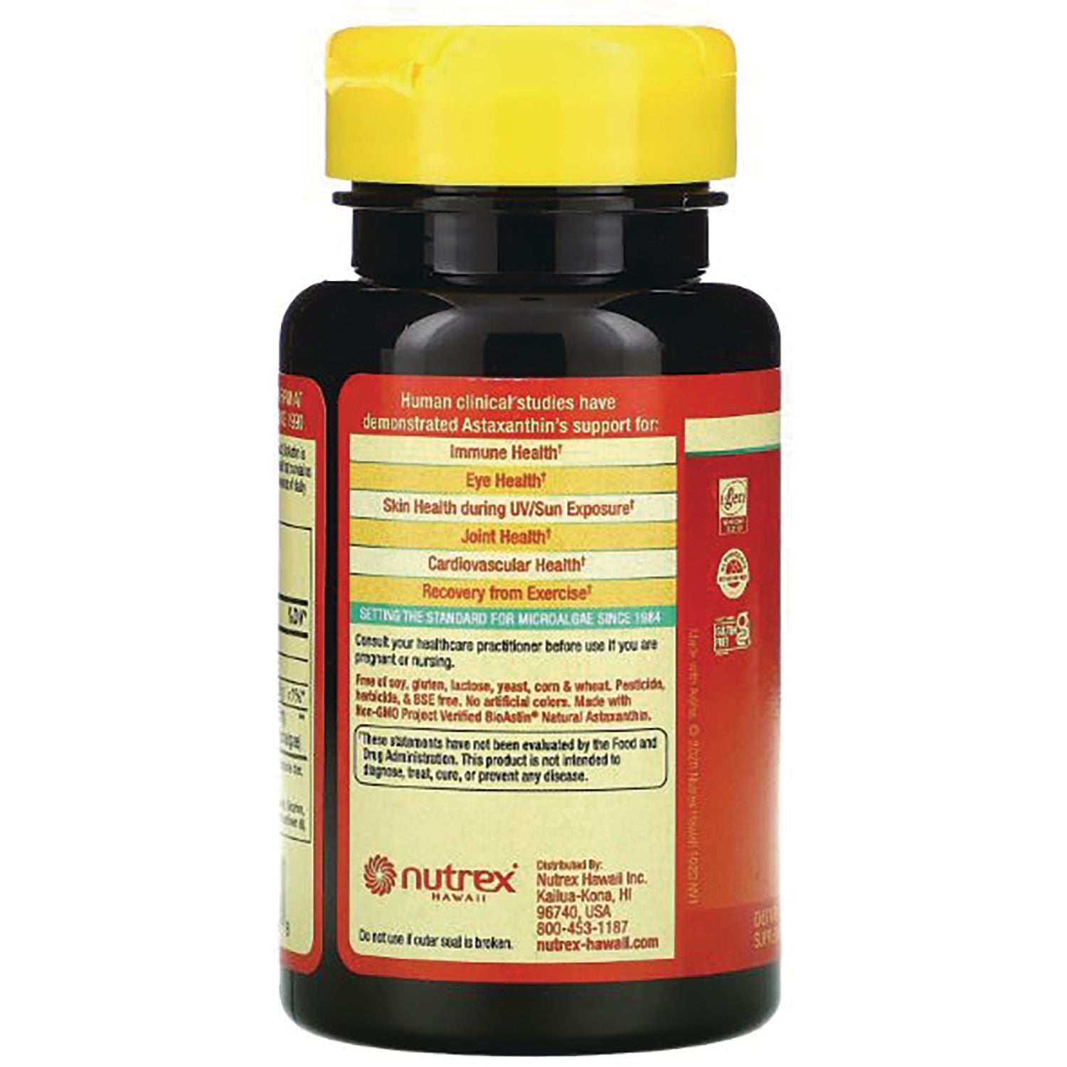 NUT022 | Back of dark supplement bottle with yellow cap showing label text of benefits, warnings, and Nutrex Hawaii logo