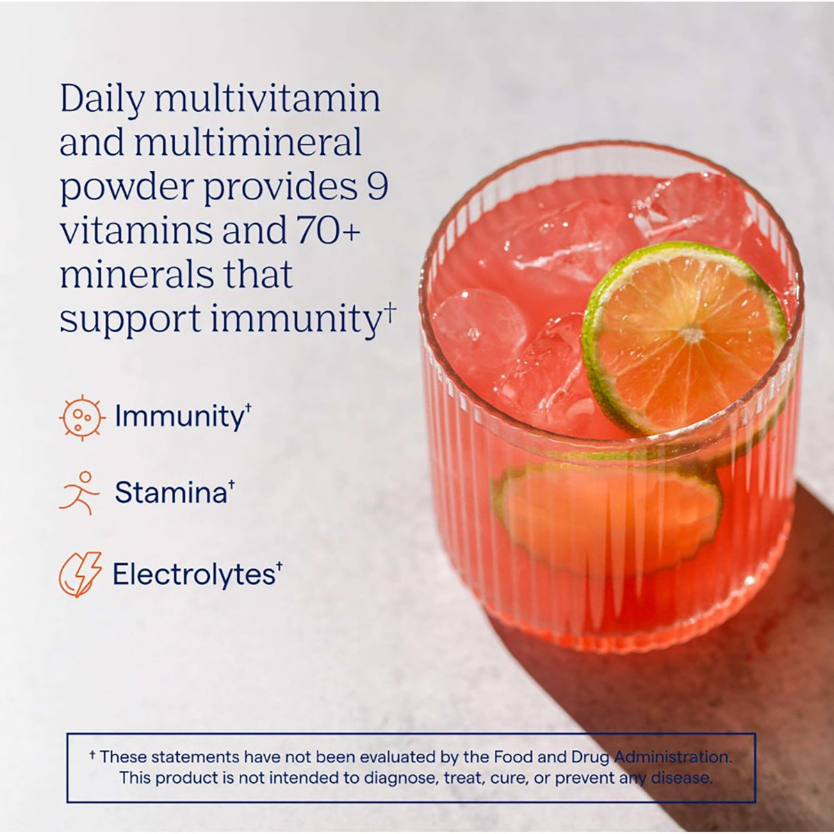 TM018 | Daily multivitamin powder in a glass with citrus garnish, highlighting immunity, stamina, and electrolytes