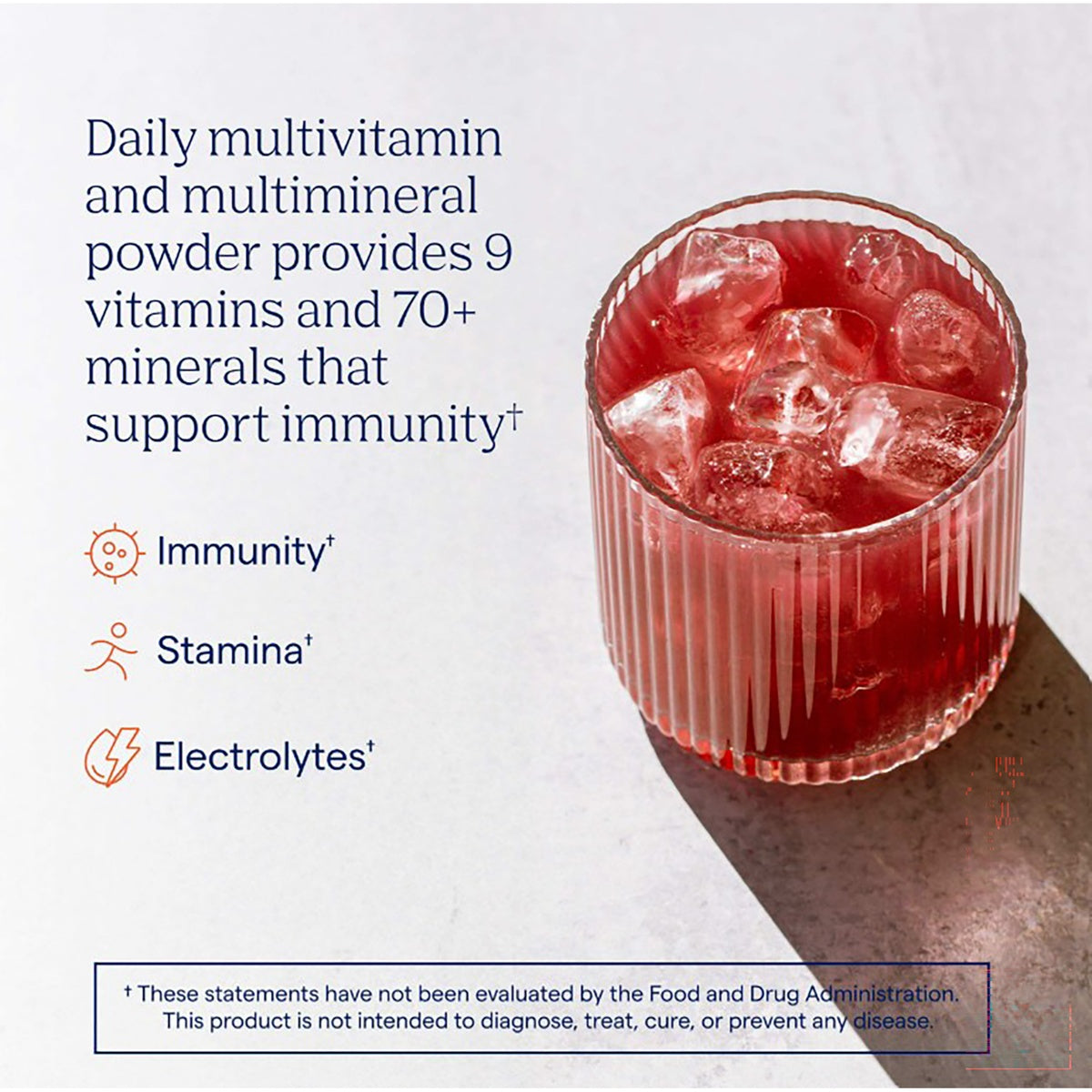 TM046 | Daily multivitamin and multimineral powder in a glass with ice, highlighting immunity, stamina, and electrolytes