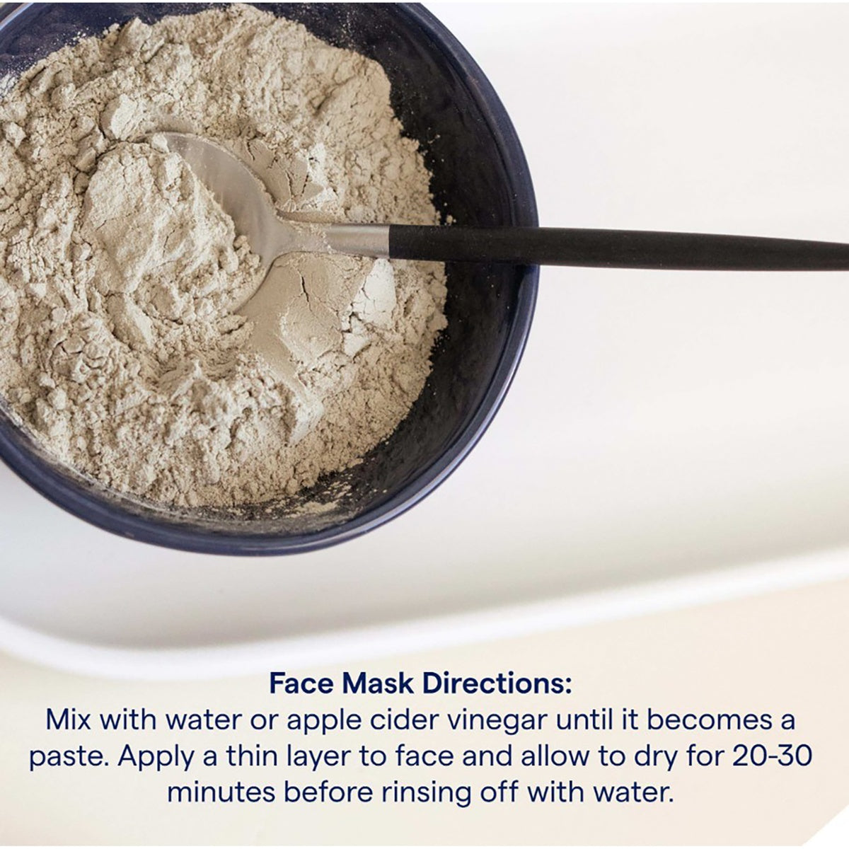TM087 | Face mask powder in a bowl with spoon and mixing directions for water or apple cider vinegar