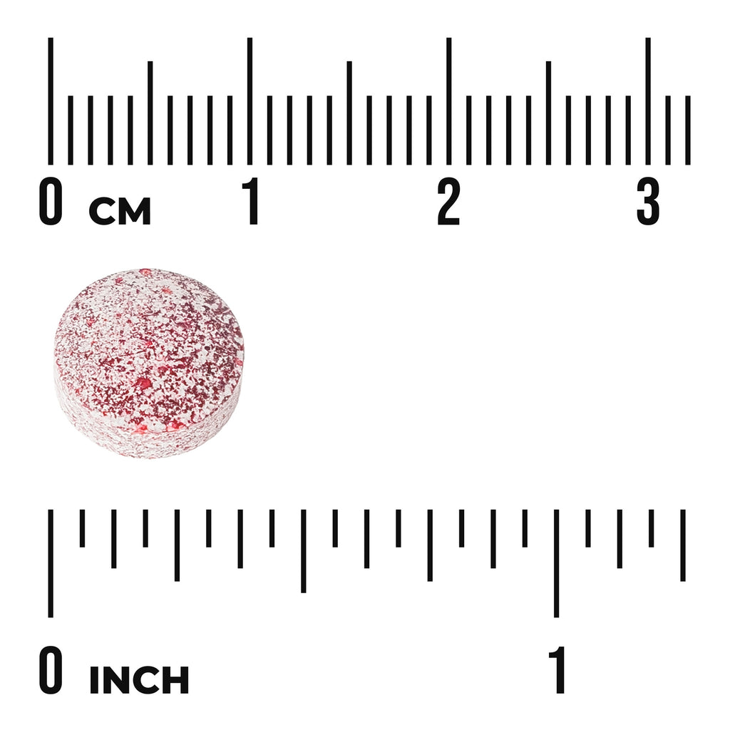 SWU783 | Round speckled red tablet next to centimeter and inch rulers, about 1 cm diameter - Thumbnail