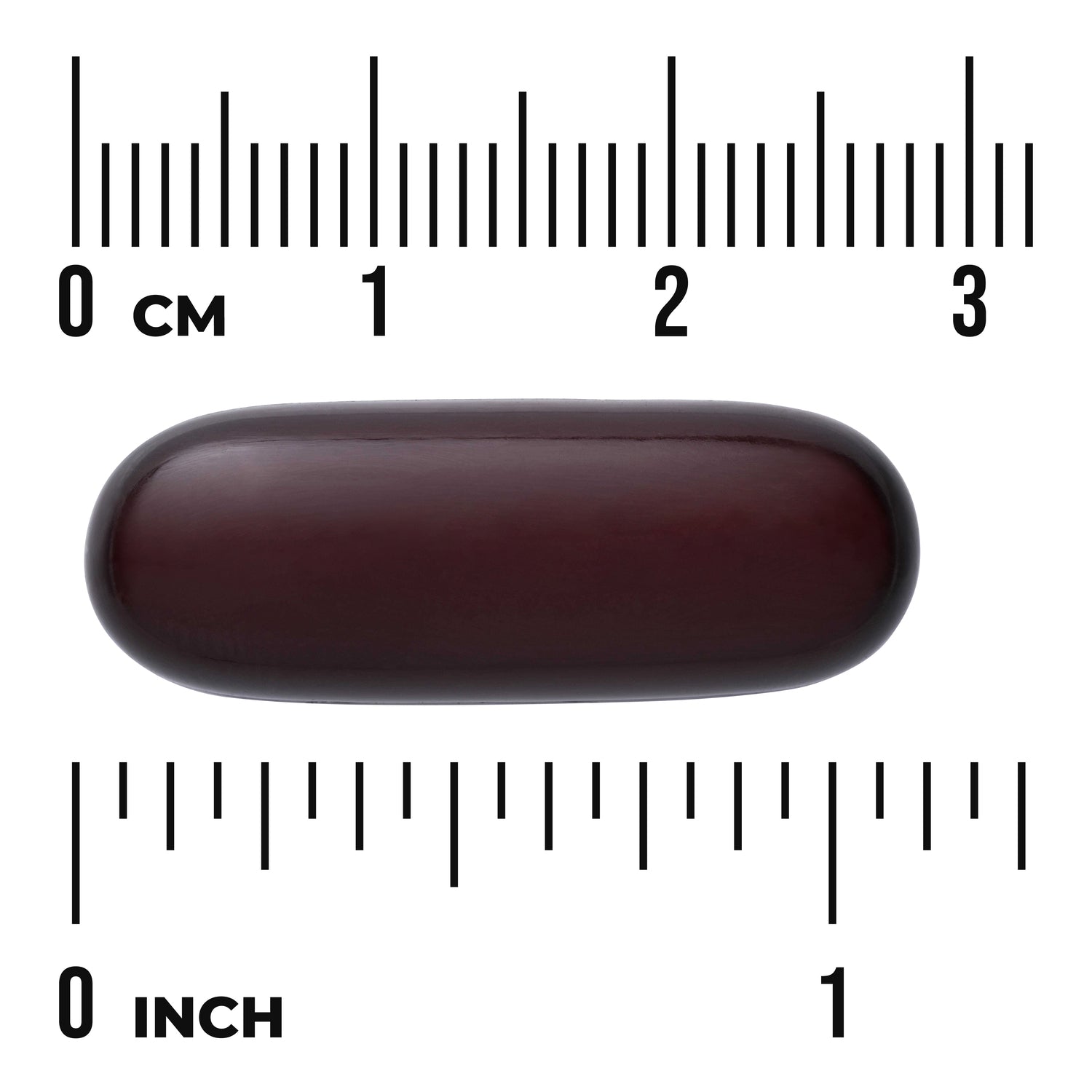 SWU083 | Dark brown oblong softgel capsule centered between centimeter and inch rulers with visible text "CM" and "INCH"