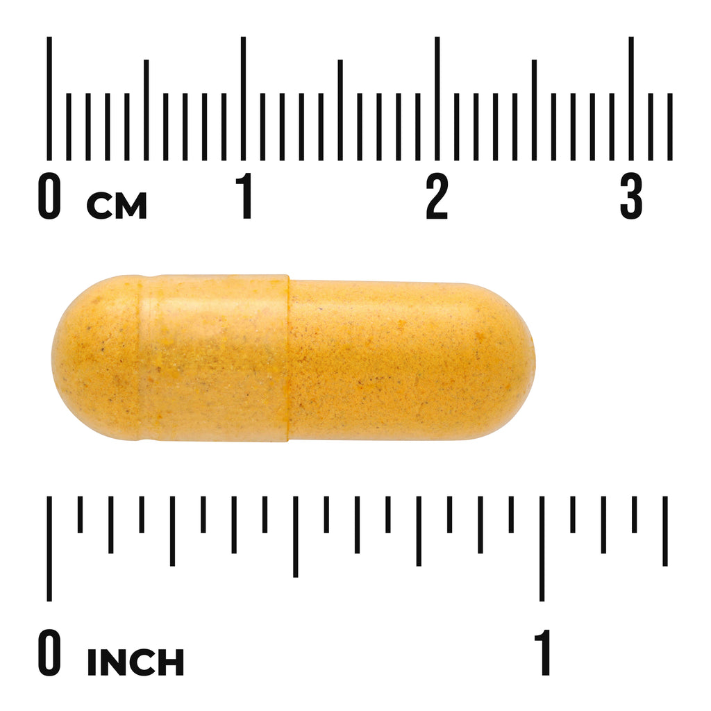 SWC053 | yellow capsule pill on white background with centimeter and inch rulers showing size - Thumbnail