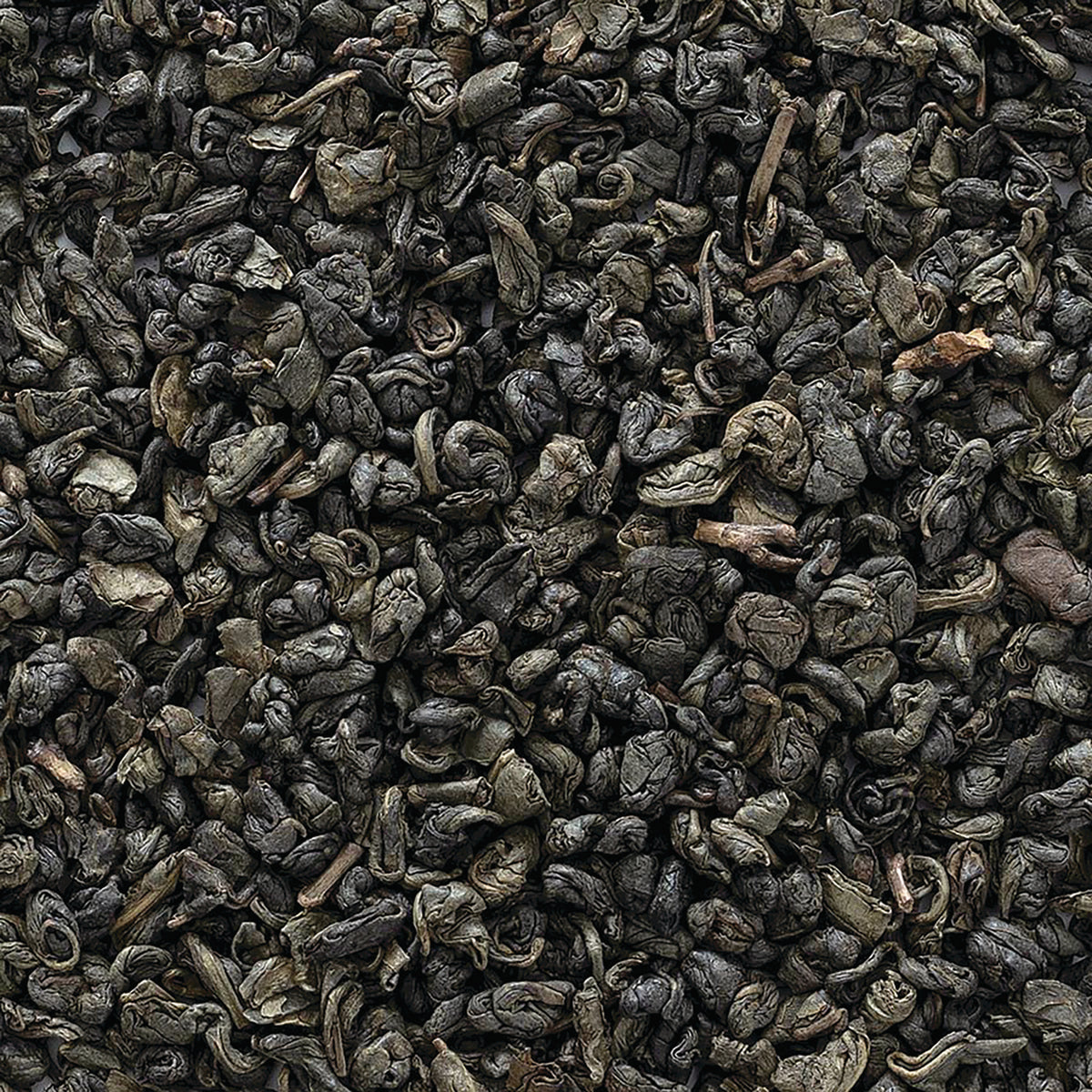 FNP082 | Close-up of rolled dark green loose tea leaves showing curled gunpowder-style leaves