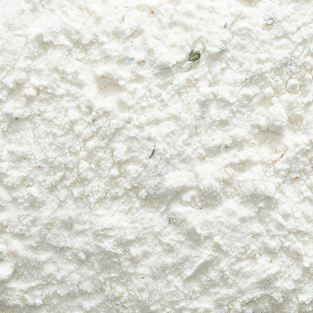 FNP077 | close-up of fine white powder with small clumps and granular texture - Thumbnail