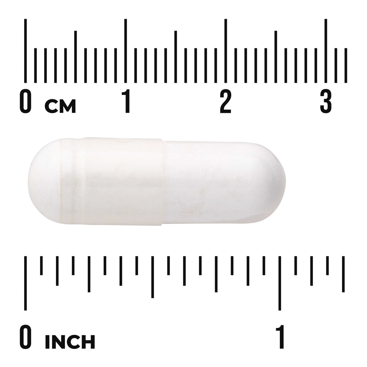 SW990 | White capsule next to centimeter and inch rulers