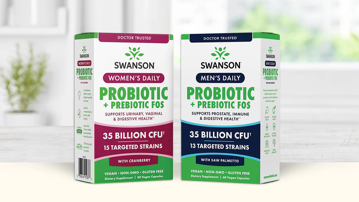 Two Swanson brand probiotic supplement boxes on a white surface with a blurred indoor background.