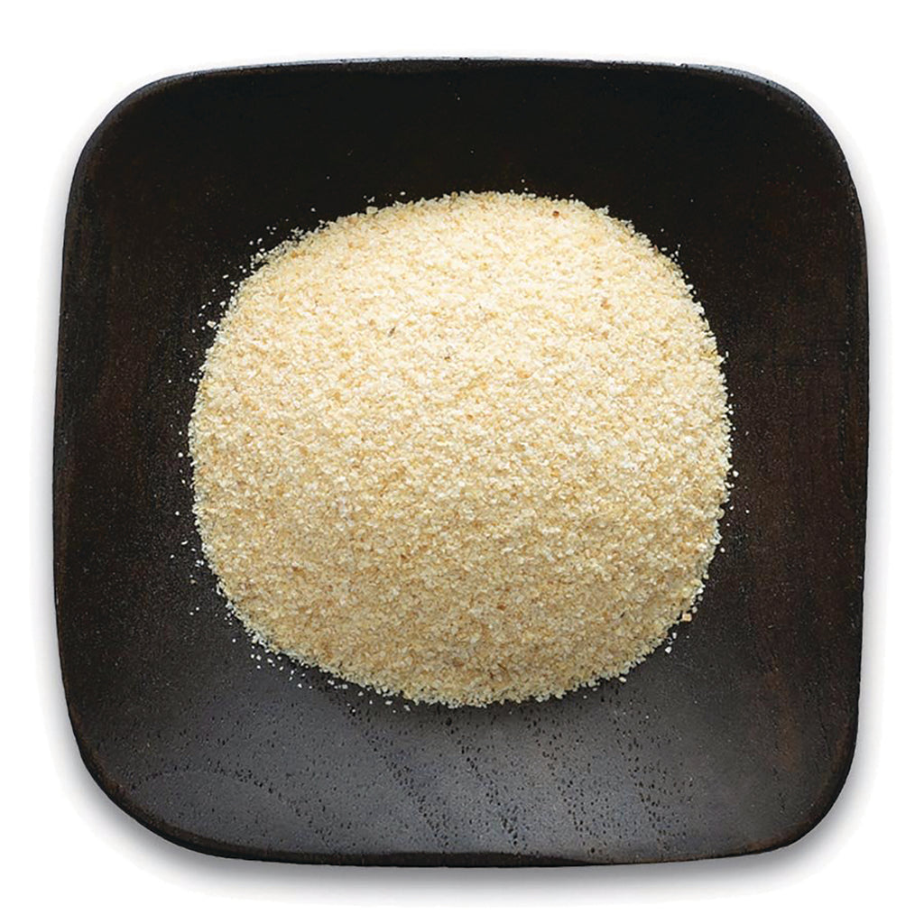 FNP036 | mound of fine pale yellow powder on a dark square wooden plate - Thumbnail
