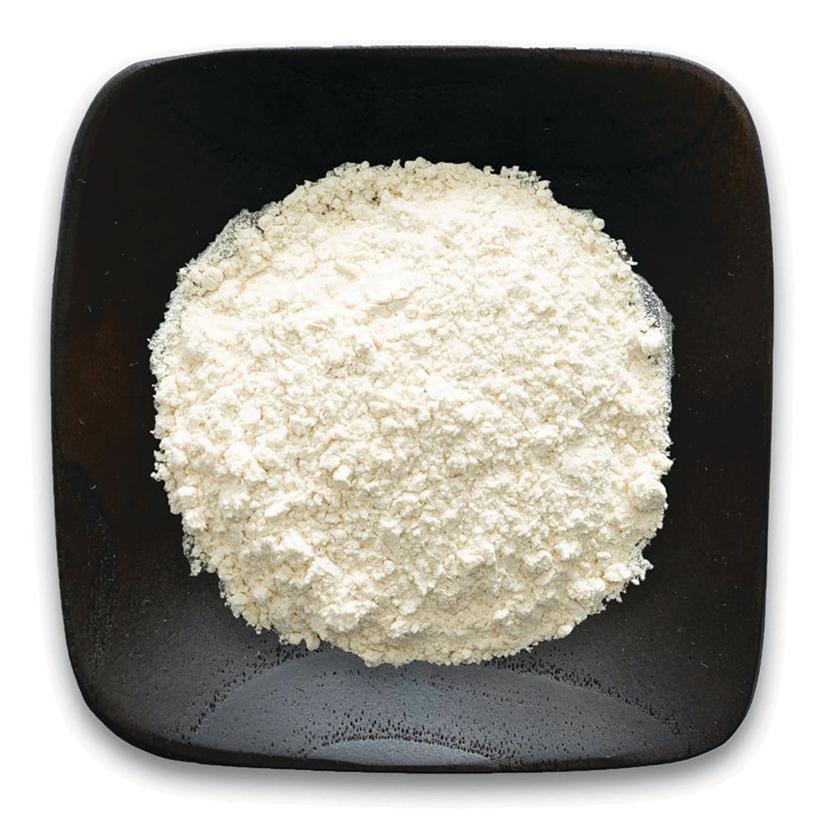FNP074 | white powder on a dark square plate, top-down view