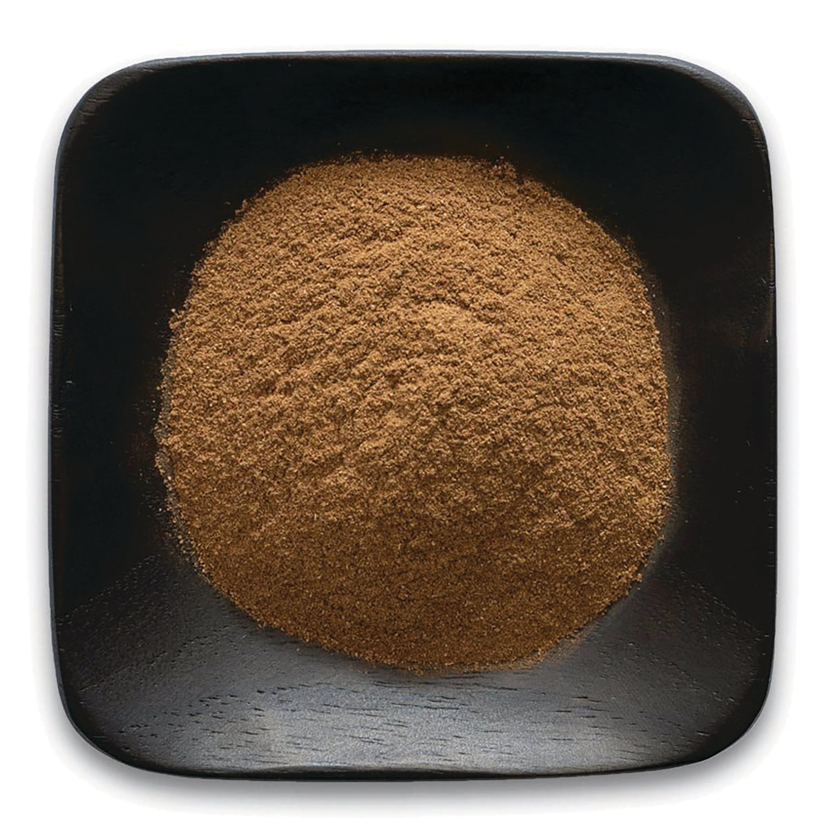 FNP153 | top-down view of fine brown powder mounded in a square black wooden dish
