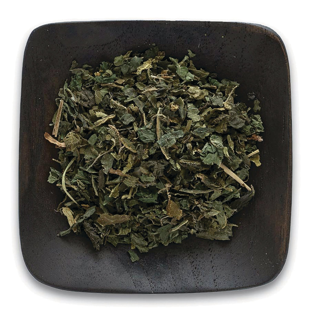 FNP018 | loose dried green herb leaves on a dark square wooden dish - Thumbnail
