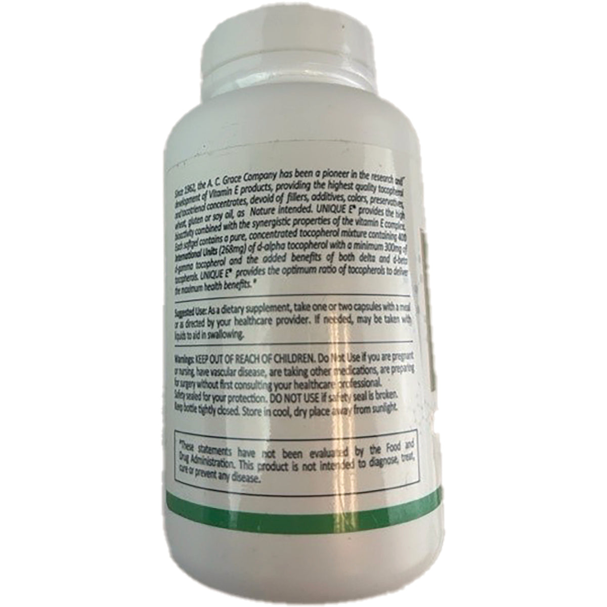 ACG002 | Back of white supplement bottle showing warning, usage and nutrition text including 'KEEP OUT OF REACH OF CHILDREN'