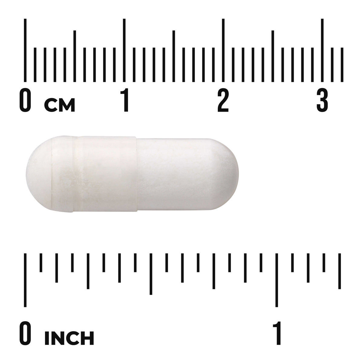 SWU977 | White capsule shown against centimeter and inch rulers for scale with visible text "CM" and "INCH"