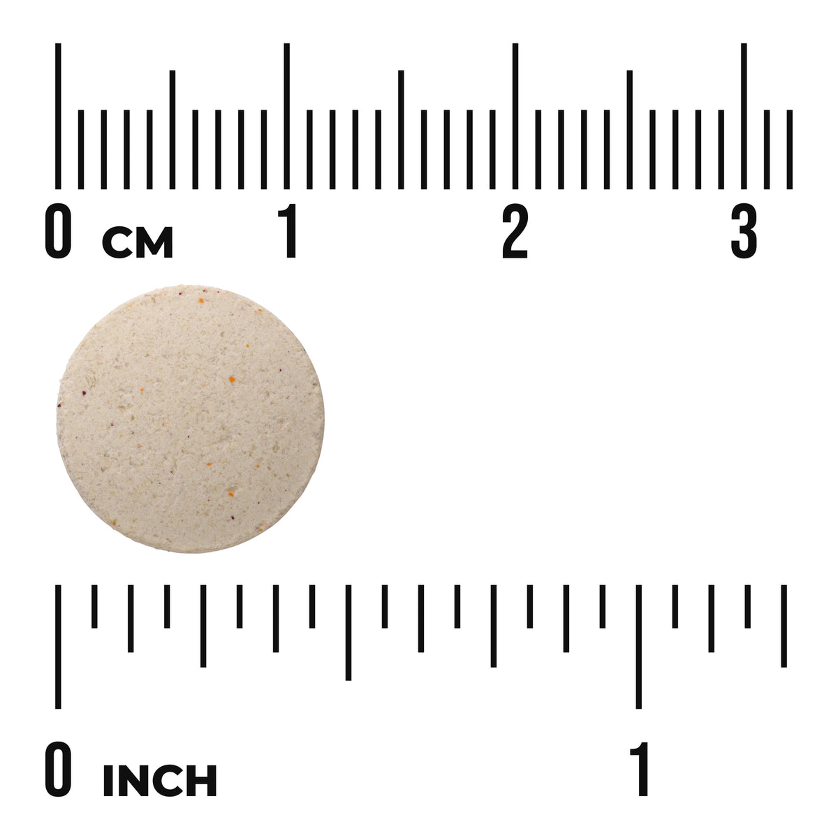 SW835 | Round beige tablet with speckles beside ruler showing 0 cm and 0 inch for size