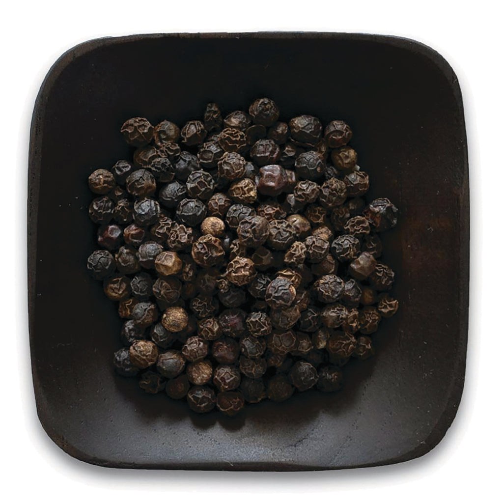 FNP039 | pile of whole black peppercorns in a dark square bowl on white background - Thumbnail
