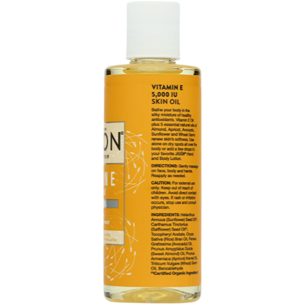 JC033 | Back label of clear bottle of Vitamin E 5,000 IU skin oil showing directions, caution, and ingredient list - Thumbnail